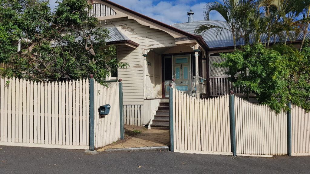old wood house and fence